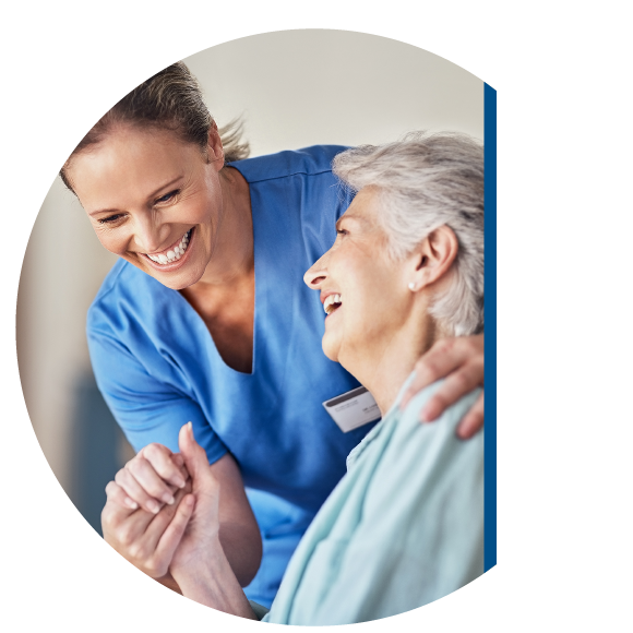 Older woman with nurse holding hand.